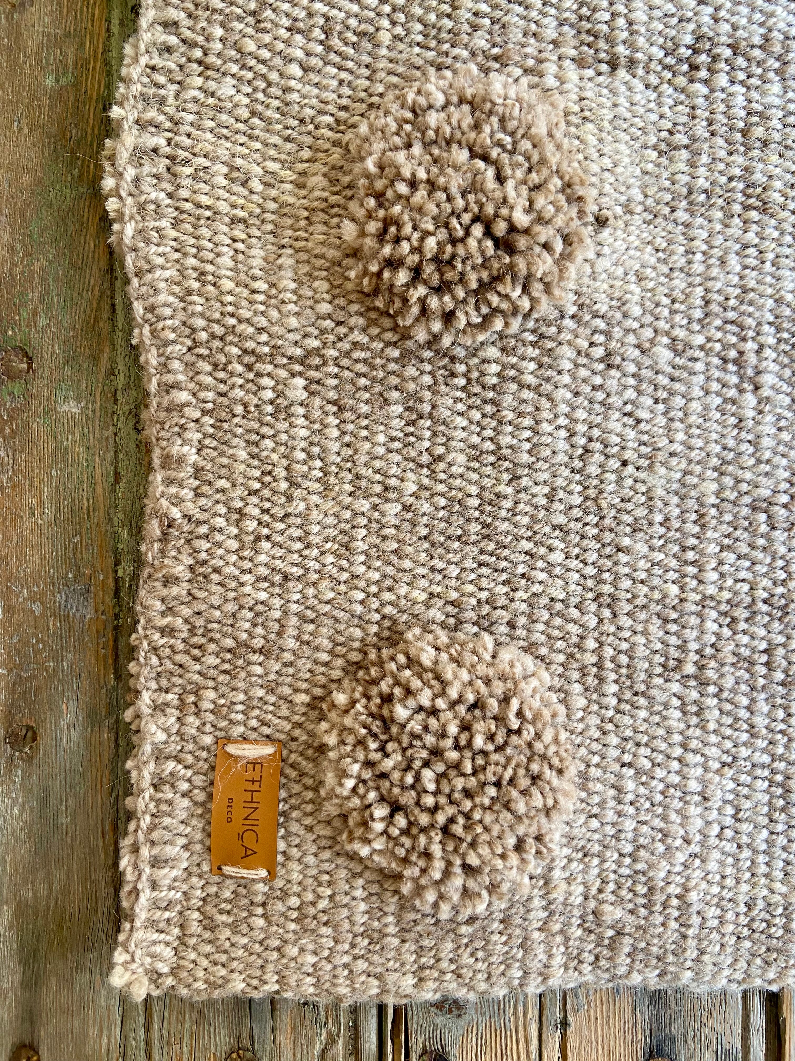 White Pompoms S Rug made of 100% sheep wool 